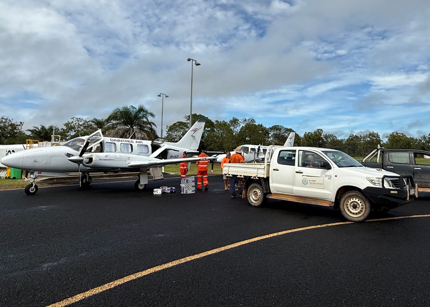 image of small plane on Coen runway being unloaded into a ute
