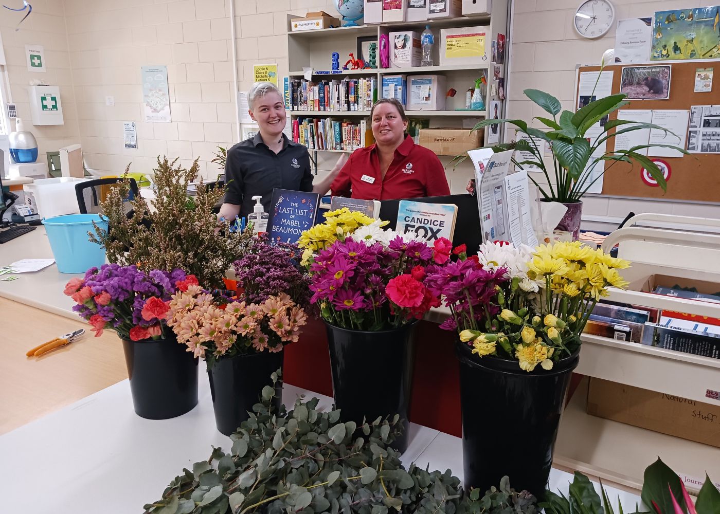 COOKTOWN LIBRARY STAFF WITH FLOWERS